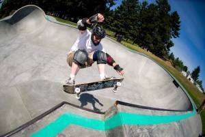 boy skateboarding in park