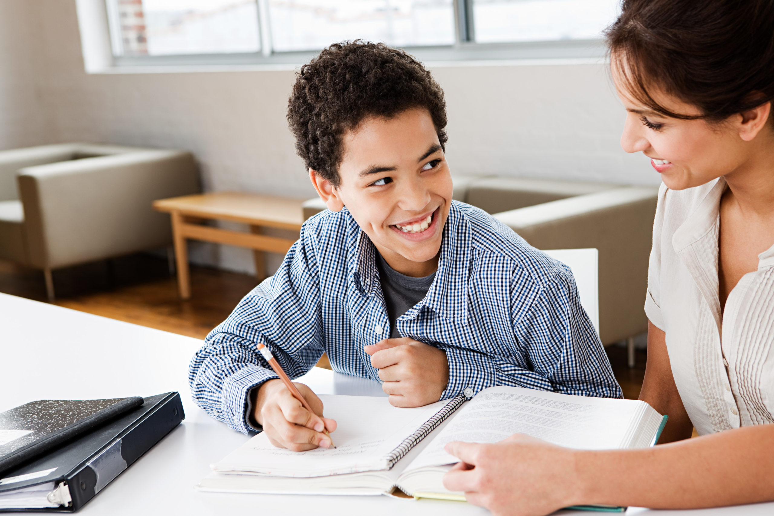 Woman mentoring boy