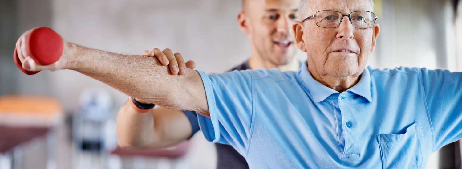 PT working with male patient