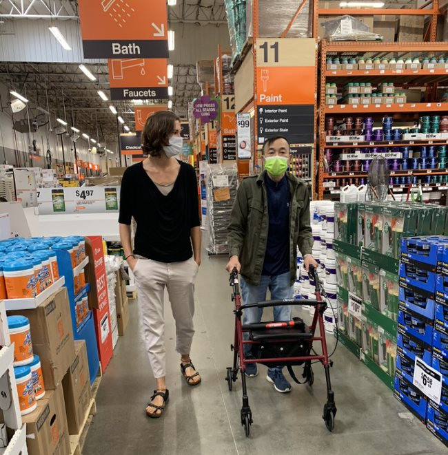 woman shopping with disabled man