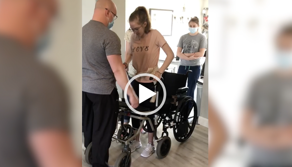 Woman in wheelchair in PT rehab setting