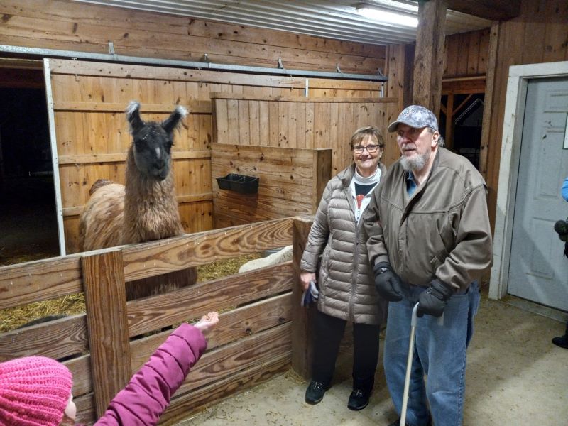 Image of Kevin and his wife in an animal barn