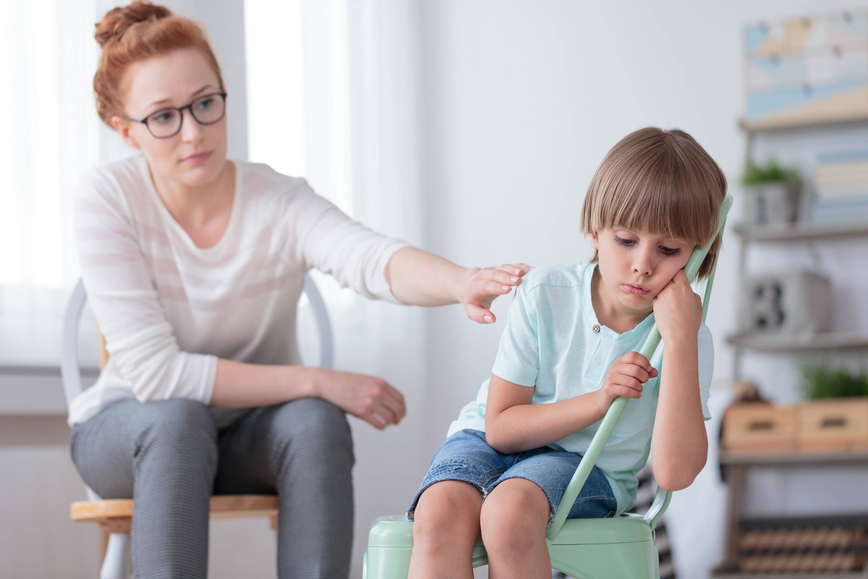 Sad autistic boy and psychotherapist Rehab Without Walls