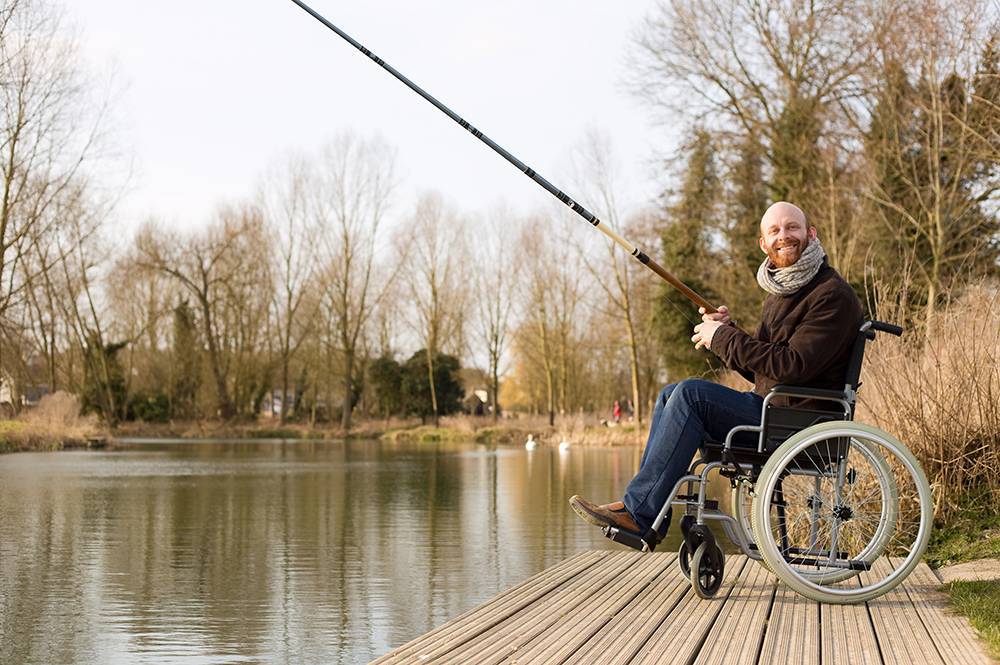 Man in wheelchair fishing