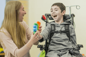 teacher with boy in wheelchair